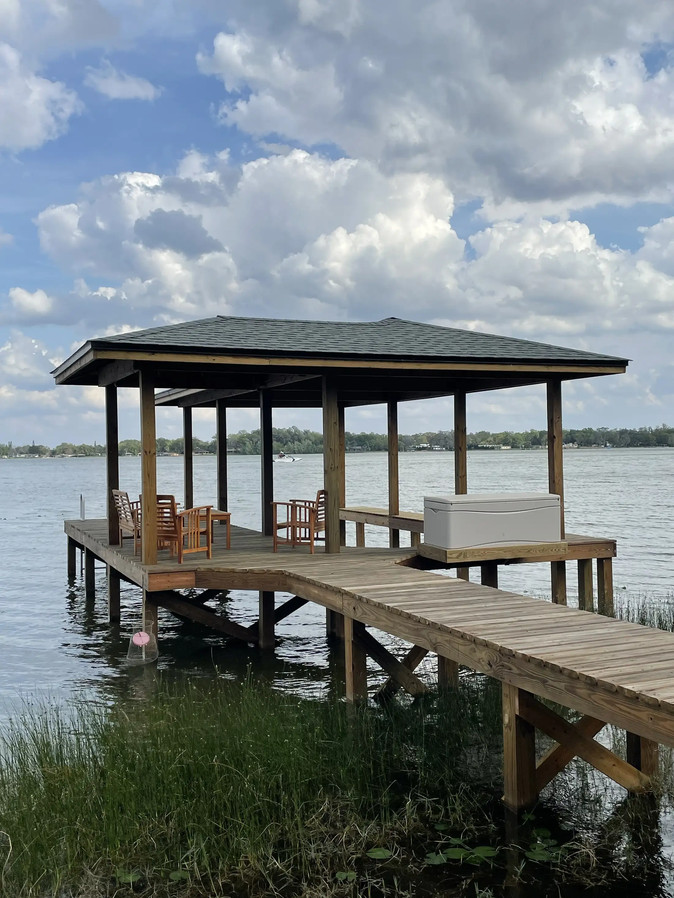 Wide view of a covered boat dock over the water