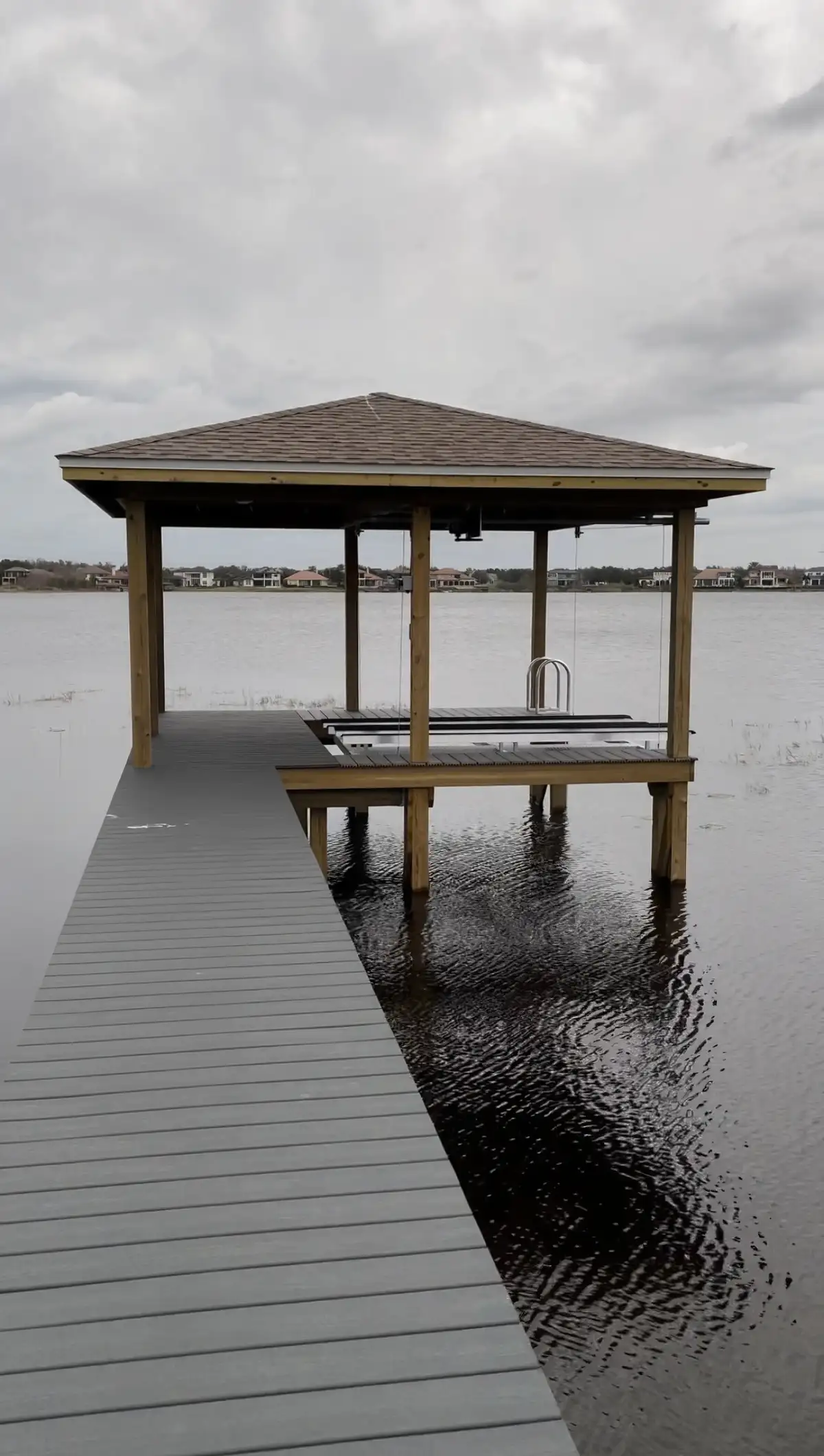 Covered dock structure over cloudy water